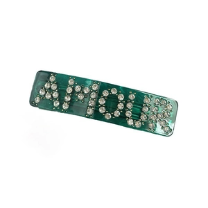 Green marble acetate hair clip featuring AMOUR rhinestone lettering for women