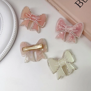 Elegant bow hair clips with acetate marble texture, pearls and rhinestones decoration
