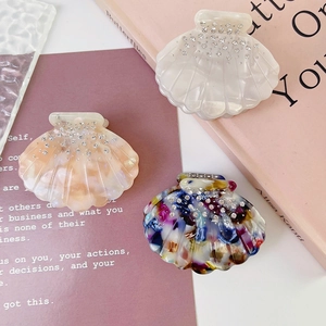 Elegant shell-shaped acetic acid hair claws with rhinestones in white, pink, and multi-color