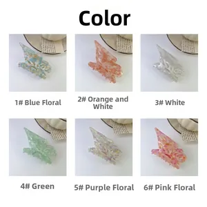 Flat lay of six colorful acetate butterfly hair claws on a clean white background