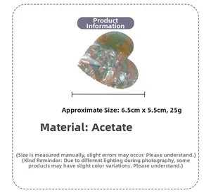 Detailed view of checkered acetate heart hair claw clip with dimensions 6.5cm by 5.5cm