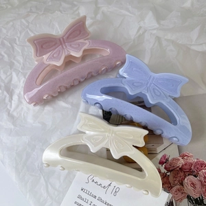Pinces à cheveux en forme de nœud tons crème, bleu pastel et rose-violet pailleté