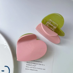 Minimalist checkered heart hair claw clip in pink and green contrast acetate finish