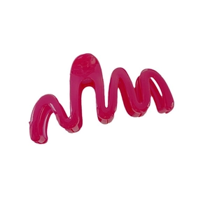 Large wave-shaped hair claw clip in vibrant hot pink finish on white background