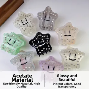 Star-shaped acetate hair claws with smiley face and rhinestones in various colors