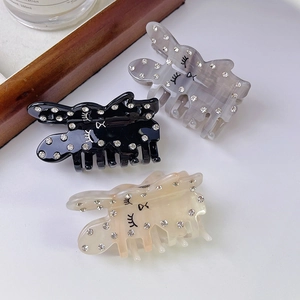 Drei Kaninchen-Haarklammern aus Acetat in Schwarz, Grau und Beige mit Glitzersteinen