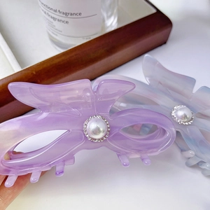 Elegant acetate bow hair claw clip with pearl and rhinestone in lilac and blue marble