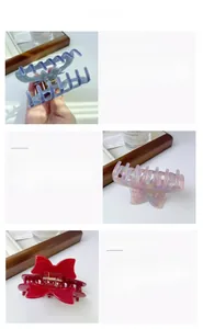 Detail view of acetate bow hair claws in purple, pink and red with gold metal springs