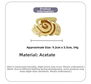 Detail view of 9.2cm acetate hair claw featuring red spiral lines and star patterns