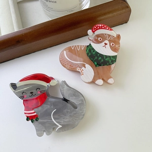 Pince à cheveux chat de Noël en acétate avec texture marbrée et chapeau festif
