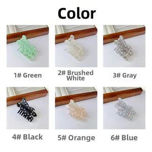 Detailed grid view of six bear-shaped hair claws with small pearls in various colors