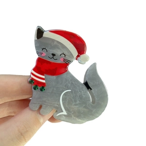 Pince à cheveux chat de Noël en acétate gris marbré avec bonnet rouge et écharpe