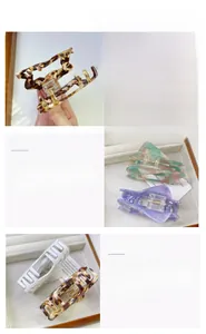 Detail view of acetate star claw clips in various colors with strong metal springs