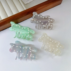Cute bear-shaped acetate hair claws with pearls and marble textures in various colors