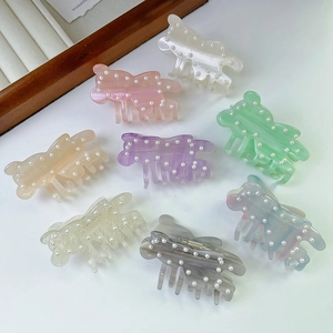 Elegant bear hair claws with pearl embellishments in eight various acetate colors