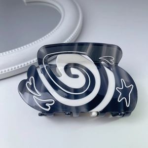 Sweet black and white marble hair claw clip with silver heart and star patterns