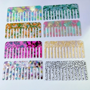 Set of eight stylish acetate wide-tooth hair combs featuring various colorful patterns