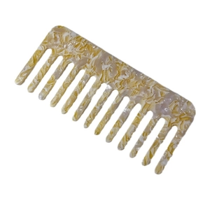 Square acetate wide tooth comb with yellow and white marble texture on white background