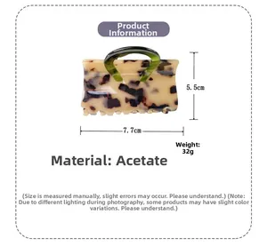 Detailed view of acetic acid hair claw with dimensions 7.7cm by 5.5cm and 32g weight