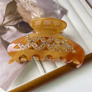 Pince à cheveux en acétate ambre avec strass en motif croisé pour femmes