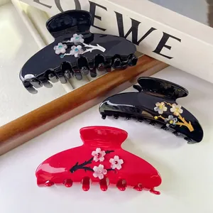 Pinces à cheveux élégantes en acétate avec fleurs de prunier et strass rouge et noir