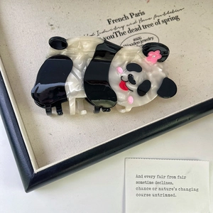 Macro detail of cute panda hair claw clip made from high quality acetate material