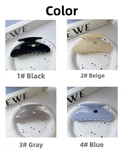 Set of four glossy acetate scallop hair claws in black, beige, grey, and blue colors