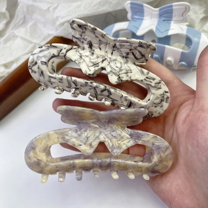 Elegant butterfly acetate hair claws in marble patterns and multiple colors for women