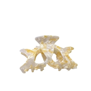 Elegant beige and amber marbled acetate hair claw clip with a strong crossover grip for women