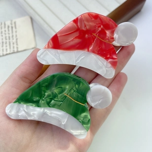 Pinces à cheveux en acétate motif bonnet de Noël rouge et vert avec texture marbrée