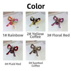 Close-up of acetate hair claw clips in rainbow, floral, and leopard print patterns