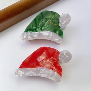 Pinces à cheveux bonnet de Noël en acétate rouge et vert avec texture marbrée nacrée