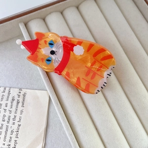 Pinza para el pelo de gato naranja de acetato con gorro de Navidad rojo y bufanda