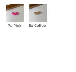 Detail of 4mm thick pink and coffee acetate heart-shaped hair clips for women