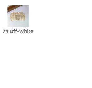 Detail view of cream white marble pattern hair comb with anti-static acetate teeth