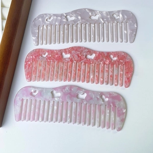 Elegant heart cutout acetate hair combs set with marble patterns and anti-static design