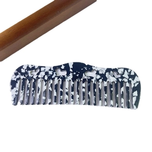 Black and white floral acetate wide-tooth hair comb with heart hollow-out design