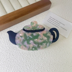 French vintage teapot hair claw made of marbled multicolor acetate and deep blue accents