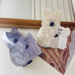 Cute acetate koala hair claw clips in lavender and cream colors with marble texture