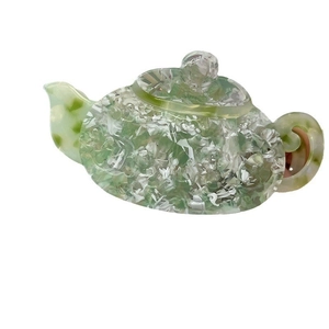 French retro teapot-shaped acetate hair claw in elegant green and white marble pattern