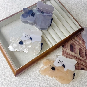 Three cute koala-shaped acetate hair claws in purple, pearl white, and apricot colors