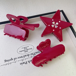 Three-piece fuchsia acetate hair claw set featuring star, heart, and rectangle designs