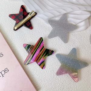 Set de 4 clips de pelo con forma de estrella con texturas de cuadros y purpurina mujer
