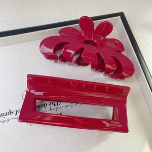 Elegant deep red acetate shark hair clips in floral and rectangular cutout designs