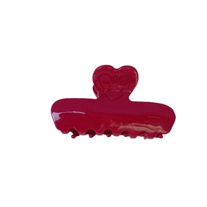 Elegant festive red acetate hair claw clip featuring a heart design with embossed logo