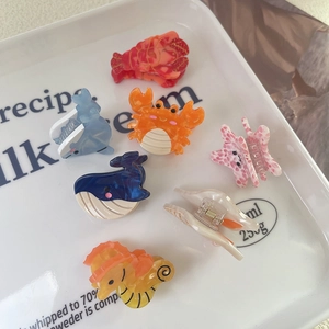 Cute marine animal acetate hair claws set featuring whales and starfish in a tray