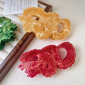 Elegant dragon hair claw clips in emerald, amber and red acetate for year of dragon