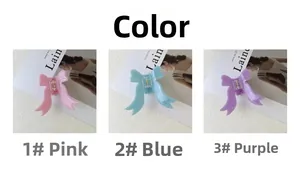 Trois élégantes pinces à cheveux avec nœuds en rose, bleu et violet avec franges