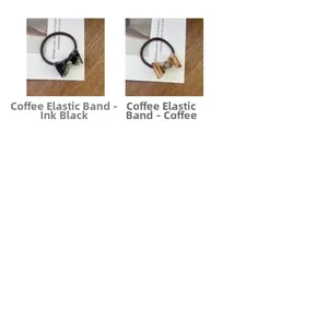 Detailed view of acetate bow hair ties with marble texture and sparkling rhinestone beads