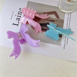 Pinces à cheveux nœud papillon élégantes en rose, violet et bleu pastel pour femmes